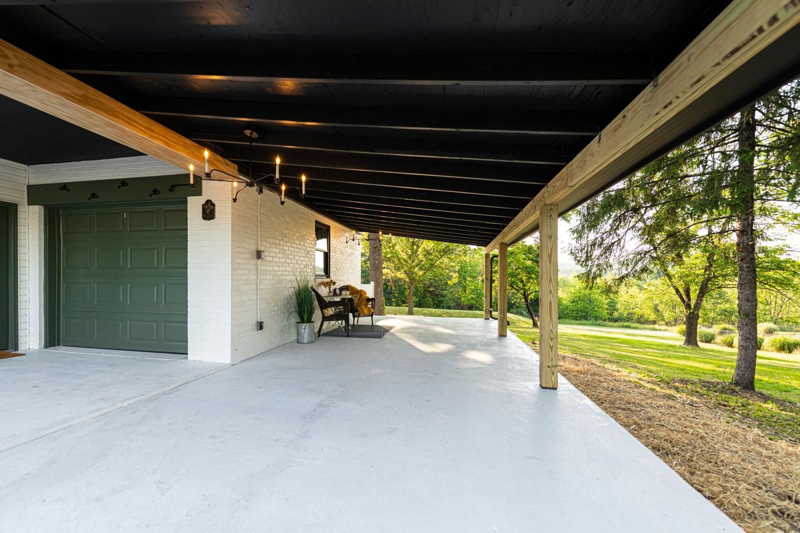 A covered patio looking out over the yard