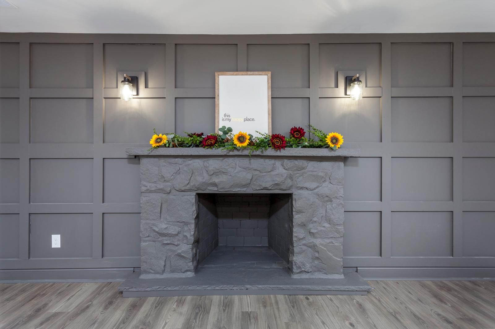 A board-and-batten fireplace wall in gray