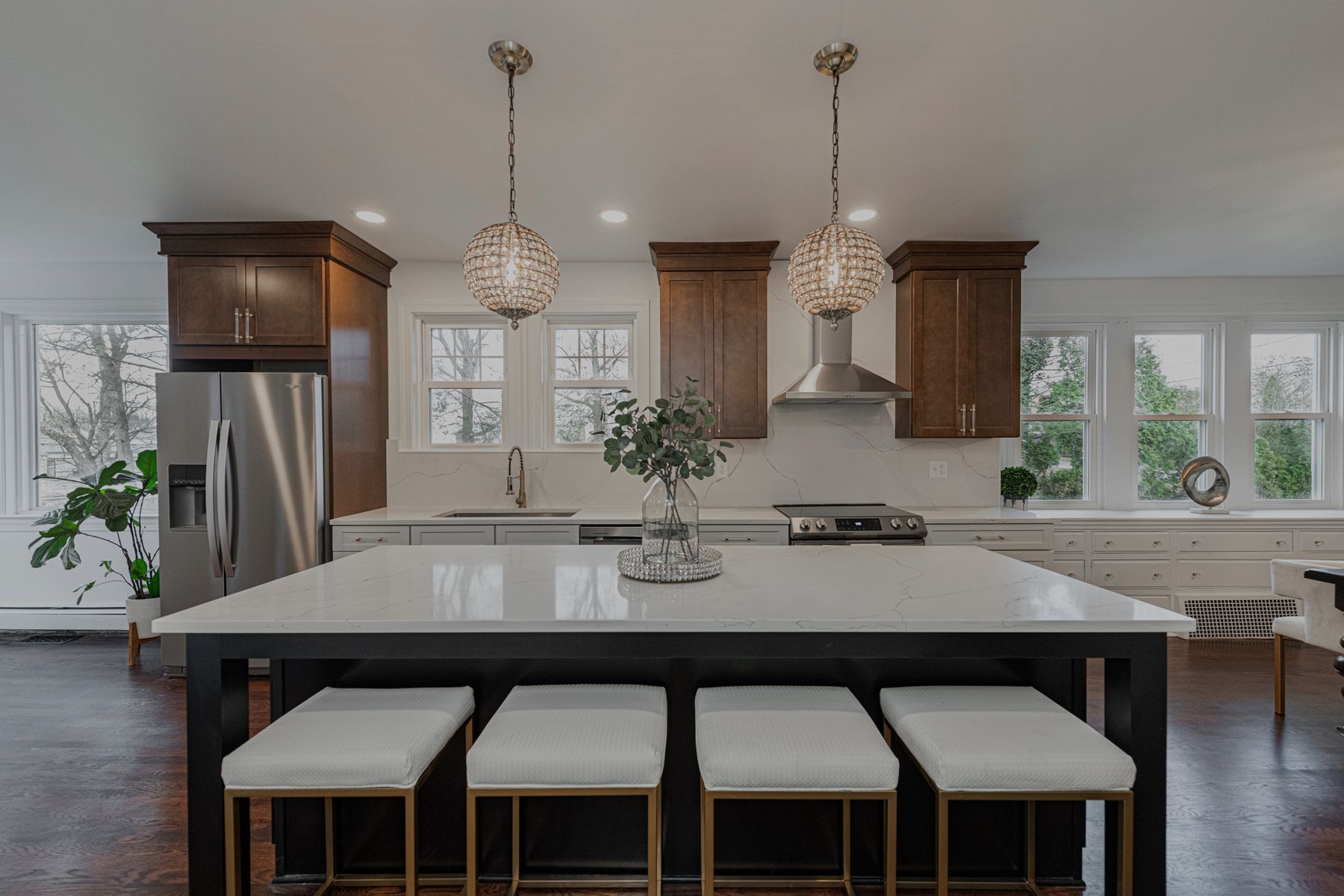 White kitchen, walnut uppers, island seating for four