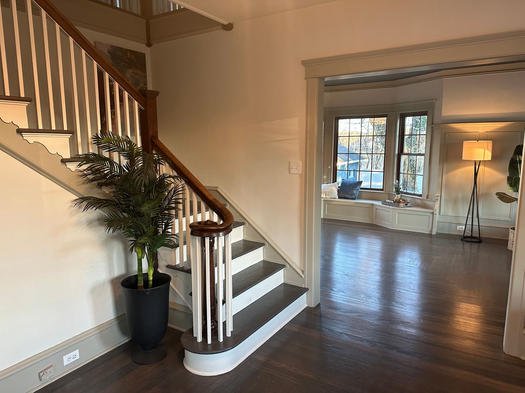 A refinished staircase with white balusters